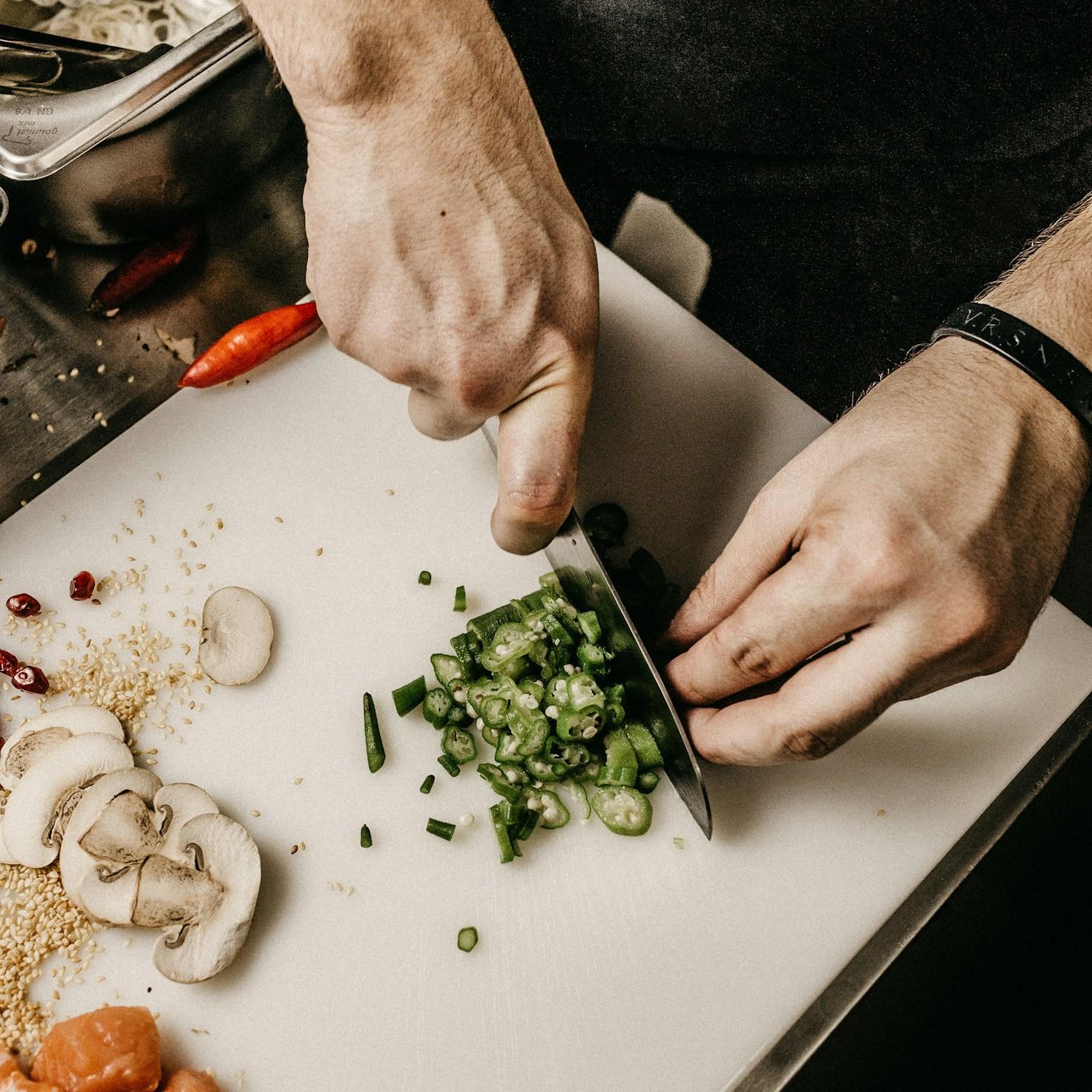 Community members collaborating in a modern kitchen space, sharing recipes and cooking techniques